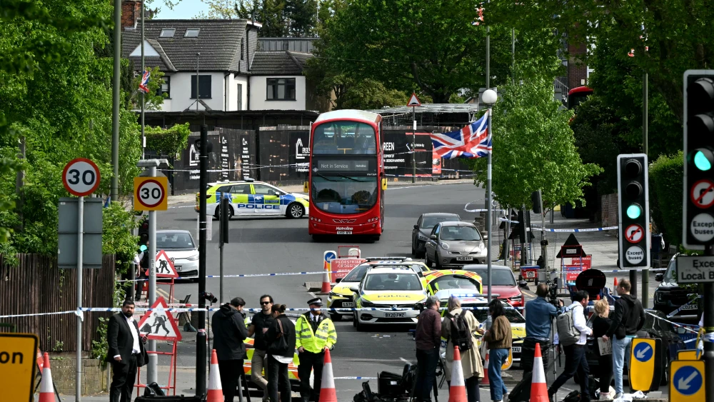 Members of the media work at a Police cordon following the stabbing of two people, and a suspect's arrest in north London, the U.K., on April 29, 2026, . Photo by JUSTIN TALLIS / AFP via Getty Images.