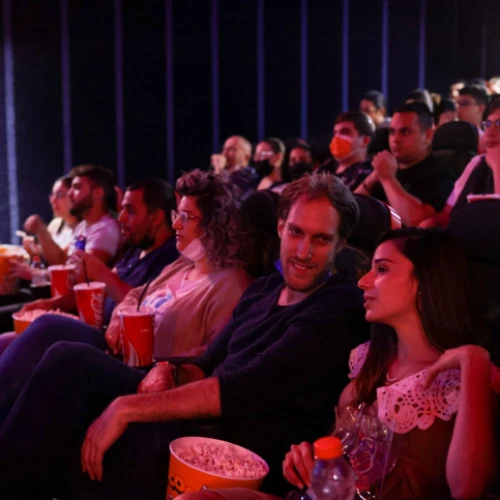 Israelis attend a movie at the Cinema City theater on the official reopening night after 14 months of closure during the coronavirus pandemic, on May 27, 2021 in Jerusalem. Photo by Olivier Fitoussi/Flash90.