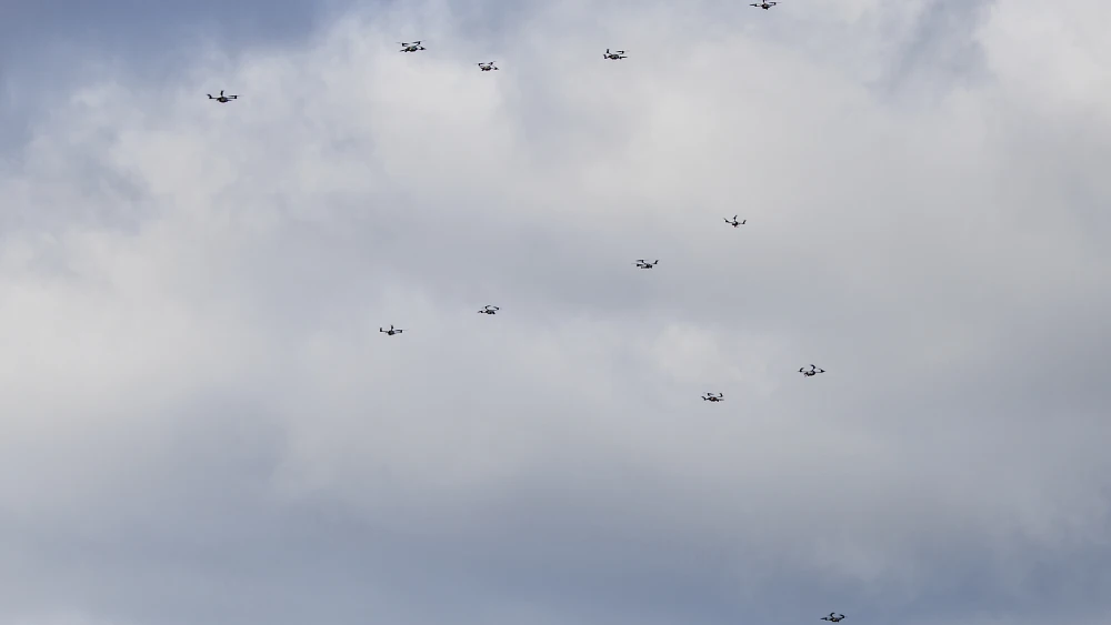 Drones form a swarm during a live presentation as part of the Project Flytrap 4.5 exercise of counter-drone technologies at the Putlos military training center on Nov. 21, 2025 at Putlos, Germany. Photo by Morris MacMatzen/Getty Images.
