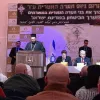Click photo to download. Caption: Father Gabriel Naddaf addresses Christian IDF soldiers in December 2014, with Israeli Prime Minister Benjamin Netanyahu (sitting at table, in center) in attendance. Credit: Maor X via Wikimedia Commons.