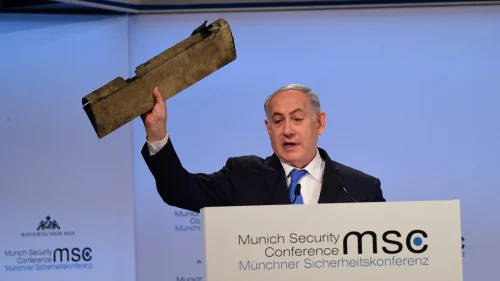 Prime Minister Benjamin Netanyahu displays a fragment of an Iranian drone destroyed over Israeli airspace in February 2018 during his speech at the Munich Security Conference. Credit: GPO.
