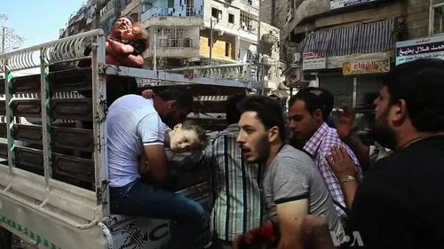 Wounded civilians arrive at a hospital in Aleppo during the Syrian civil war. Credit: Voice of America News/Scott Bob via Wikimedia Commons.