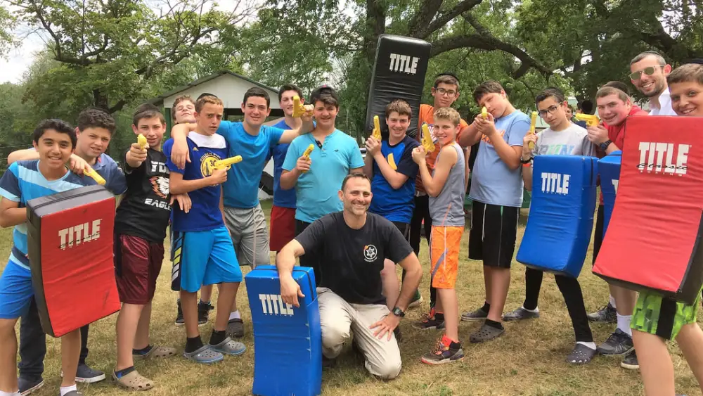 Eilon Even-Esh (center) with a group of students after a self-defense training session. Credit: Courtesy.