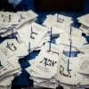 Central Election Committee workers count the remaining ballots at the Israeli parliament in Jerusalem, after the general elections, on March 25, 2020. Photo by Yonatan Sindel/Flash90