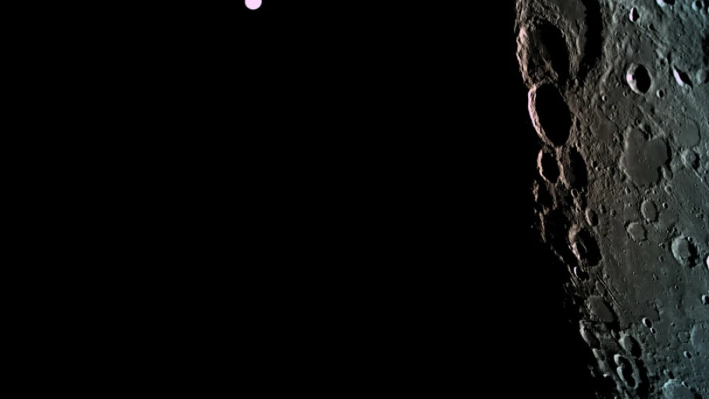 The surface of the moon as captured by the Israeli spacecraft “Beresheet” with the Earth in the background. Credit: “Beresheet.”