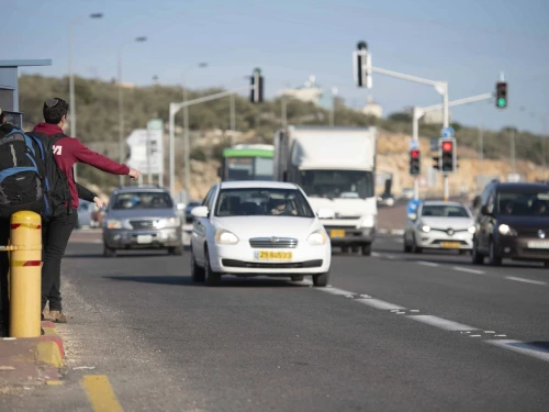 Jewish youth hitchhiking at Giti Avishar Junction on Route 5 in Samaria, Jan. 26, 2020. Photo by Sraya Diamant/Flash90.