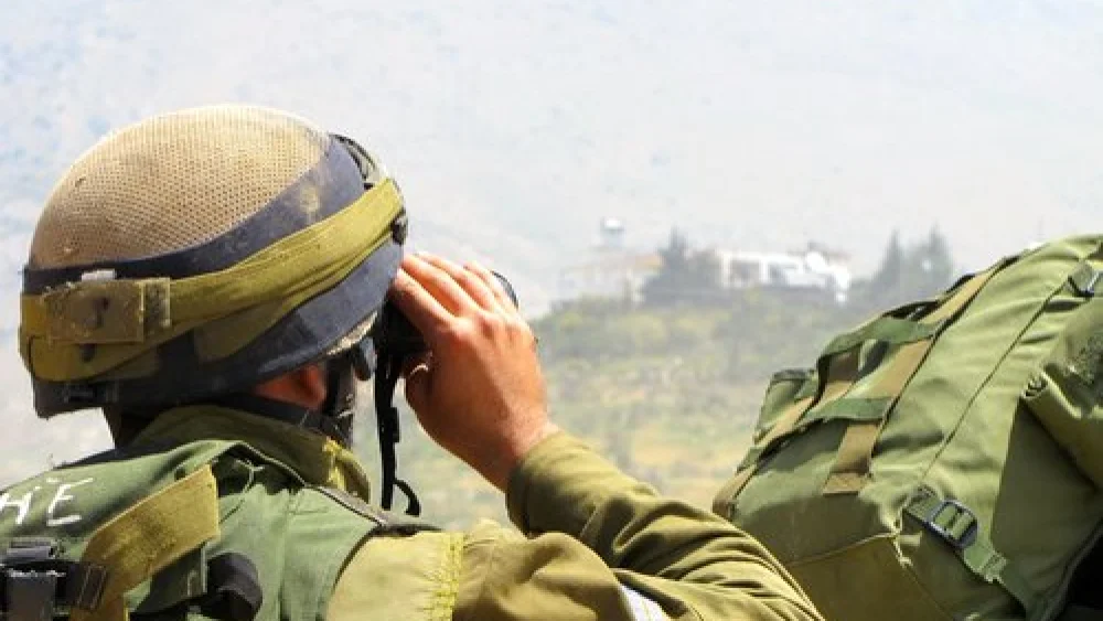 An Israeli soldier patrols near the Israel-Syria border in the Golan Heights. Credit: IDF.