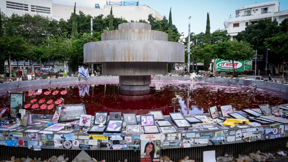 View of the Dizengoff square fountain which was colored red overnight, as a protest for the release of Israelis held kidnapped by Hamas terrorists in Gaza, July 14, 2024. Photo by Avshalom Sassoni/Flash90.