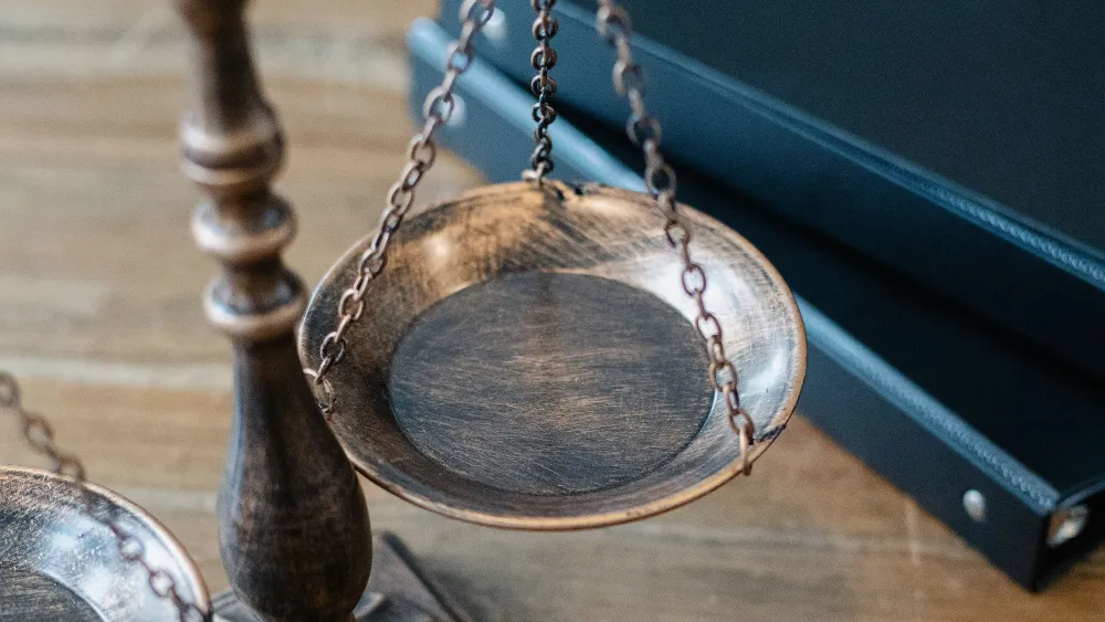 A gavel next to a scale of justice. Credit: Sora Shimazaki/Pexels.