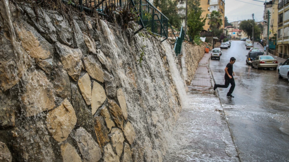 View of water streaming from the first rains of the winter season in the northern Israeli city of Tzfat on Oct. 19, 2018. Photo by David Cohen/Flash90.