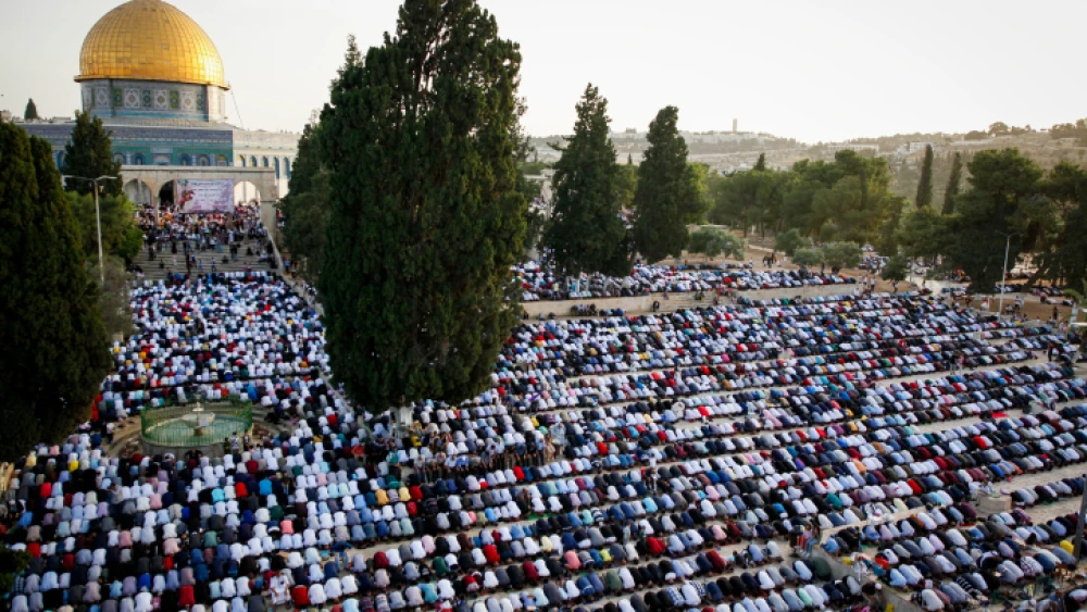 Muslims pray in front of the Dome of the Rock at the Al-Aqsa mosque in Jerusalem during the Muslim holiday of Eid al-Fitr, marking then end of the month of Ramadan, June 5, 2019. Photo by Sliman Khader/Flash90.