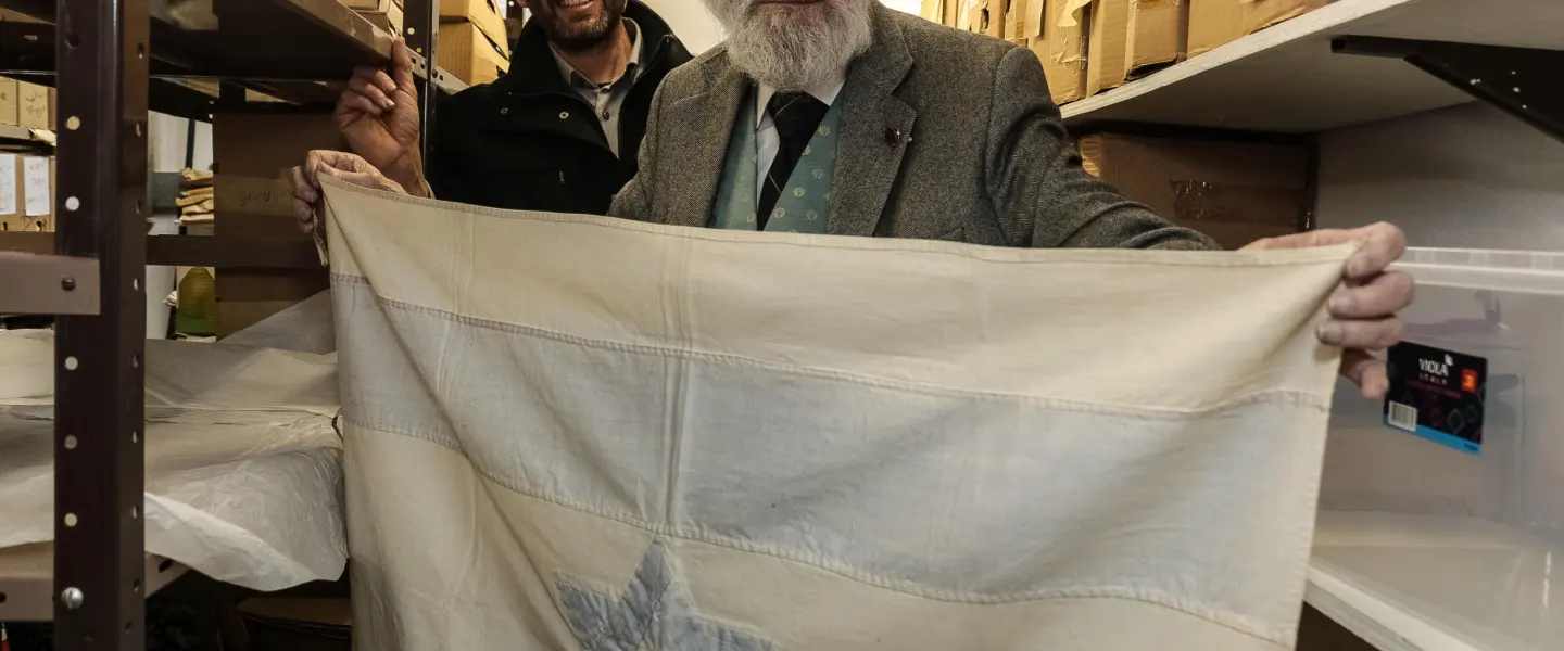An Israeli flag created by Rebecca Affachiner, often called “the Betsy Ross of Israel,” donated to the Ben-Gurion Archives at the university’s Sde Boker Campus. Credit: American Associates, Ben-Gurion University of the Negev.