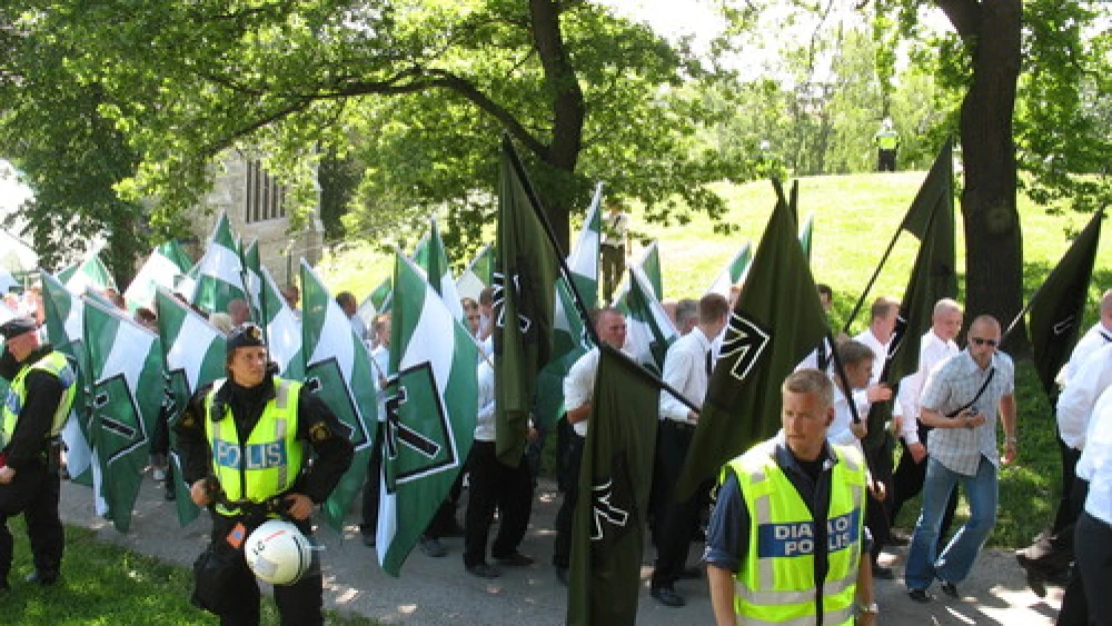 Click photo to download. Caption: Members of the neo-Nazi organization Swedish Resistance Movement take part in a nationalist demonstration in Stockholm on National Day, June 6, 2007. Credit: Peter Isotalo via Wikimedia Commons.