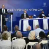 Israeli Prime Minister Naftali Bennett speaks at the changing-of-the guard ceremony, at the Prime Minister's Office in Jerusalem, for the outgoing and incoming head of the Shin Bet. To his right is incoming director Ronen Bar, seated next to outgoing head Nadav Argaman. Oct. 14, 2021. Credit: Haim Zach/GPO.