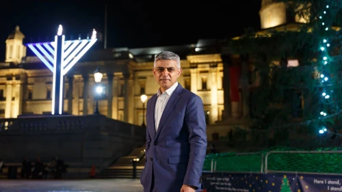 London Mayor Sadiq Khan poses next to a Chanukah menorah in Trafalgar Square on Dec. 11, 2020. Photo courtesy of Chabad-Lubavitch.