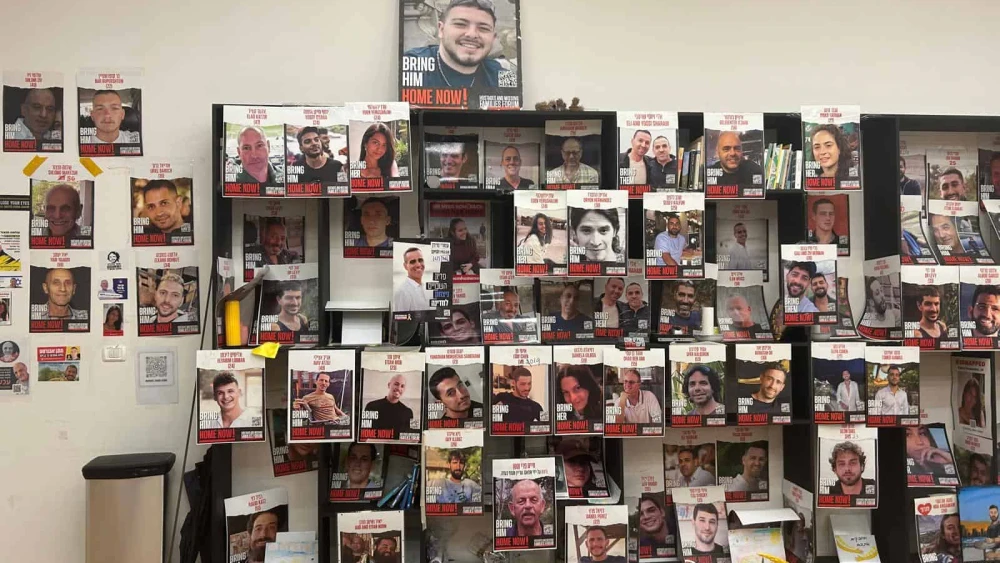 A wall of posters featuring images of the hostages in the room where the families gather during rallies, July 21, 2024. Photo by Amelie Botbol.