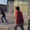 Terrorist Muhammad Abu Al-Kiyan (middle, dark jarket) being shot at by a civilian, along with an Israeli bus driver, while carrying out a knife attack in Beersheva, Israel, on March 22, 2022. Source: Screenshot/Twitter.
