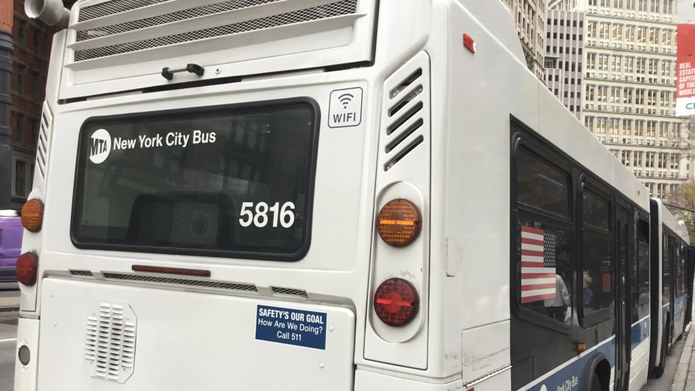 An MTA Nova Bus on Park Row in Lower Manhattan, New York City. Credit: Kidfly182 via Wikimedia Commons.