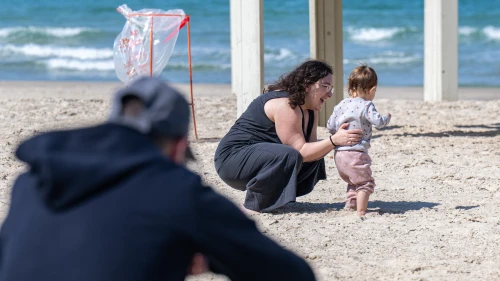 People on Beach Between Sirens
