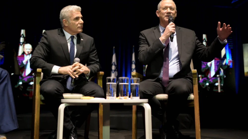 Israeli Defense Minister Benny Gantz and soon-to-be Foreign Minister Yair Lapid at a Tel Aviv International Salon election event, Feb. 17, 2020. Photo by Gili Yaari/Flash90.