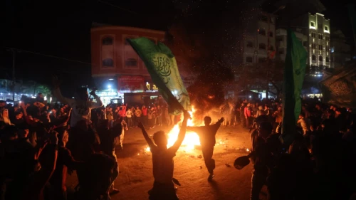 Palestinians celebrate in Gaza City following a deadly terror attack in Israel on Jan. 27, 2023. Photo by Atia Mohammed/Flash90.