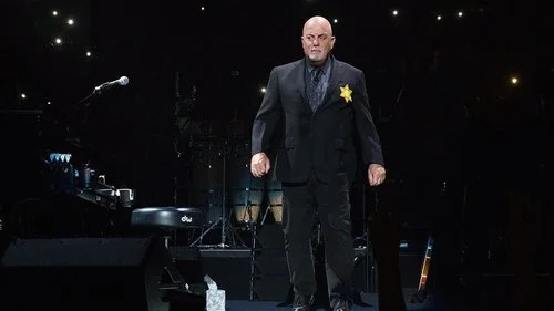 Billy Joel sports a yellow star on his jacket during a concert at New York City’s Madison Square Garden. Credit: Billy Joel via Twitter.