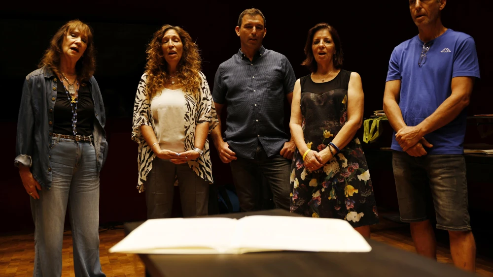 Naomi Shemer's family members sing the lyrics to "Al Kol Eleh" after donating the original manuscript to the National Library of Israel, August 14, 2025. Photo by Uri Bareket.