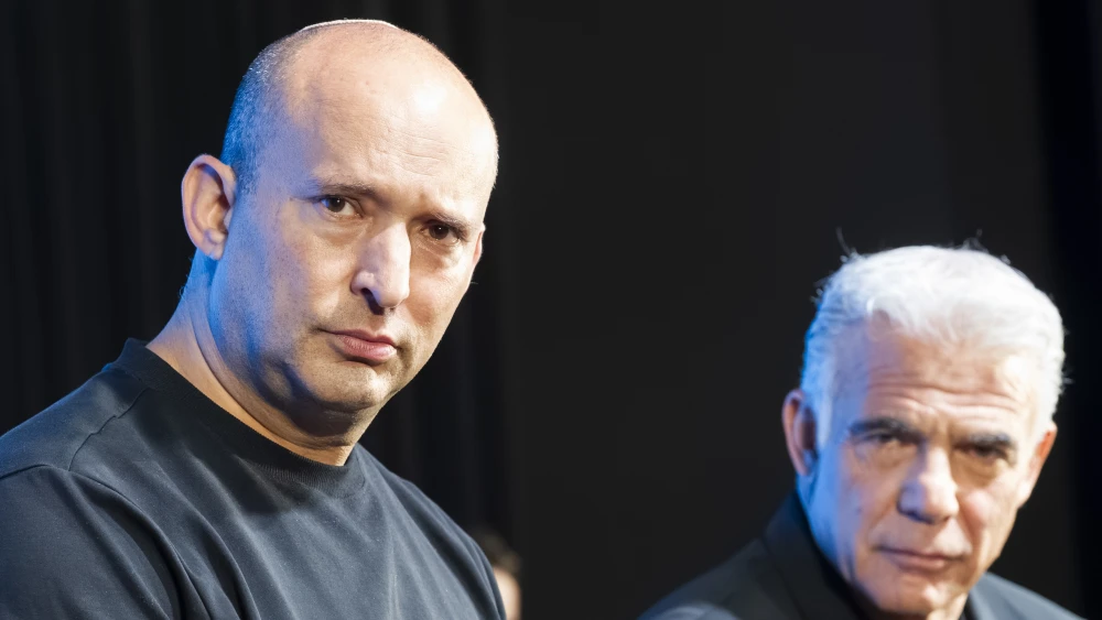 From left: Former Israeli Prime Minister and Beyachad Party chairman Naftali Bennett and Israeli Opposition Leader Yair Lapid take part in an open discussion with members of the public during an election conference in the northern Israeli city of Haifa, ahead of Israel’s upcoming general elections, on Oct. 21, 2026. Photo by Sharon Leibel/Flash90.