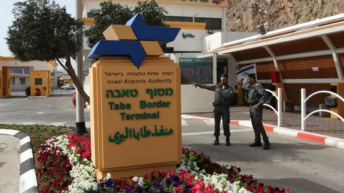 A wounded Israeli man is wheeled from Egypt to Israel, through the Taba border crossing, following a bombing at the Hilton Taba hotel in the Egyptian Sinai Peninsula, Oct. 7, 2004. Credit: Flash90.