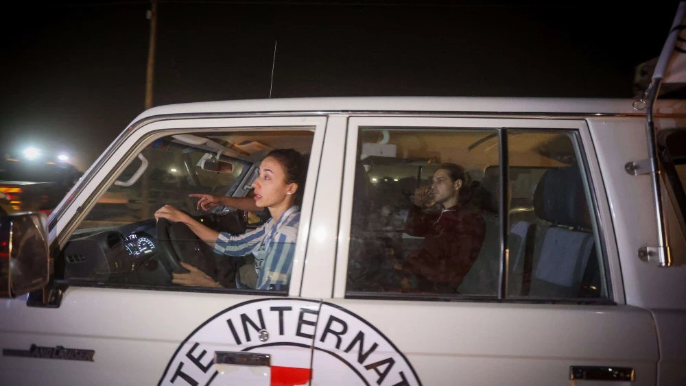 Russian-Israeli Roni Krivoi sits in a Red Cross vehicle after he was released from Hamas captivity at the Rafah crossing, Gaza Strip, Nov. 26, 2023. Photo by Atia Mohammed/Flash90.