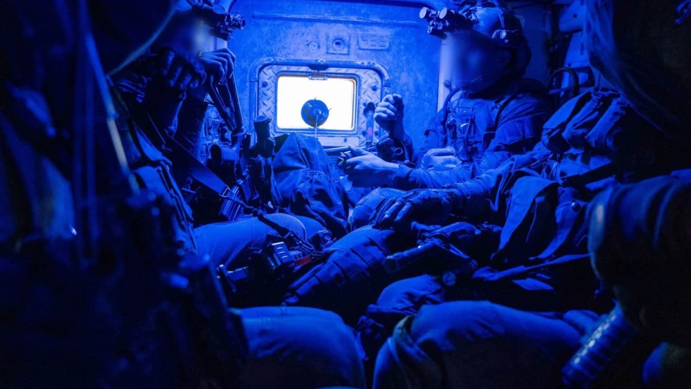 Israeli troops in an armored personnel carrier operating in the Hamas-ruled Gaza Strip, Nov. 15, 2023. Credit: IDF.