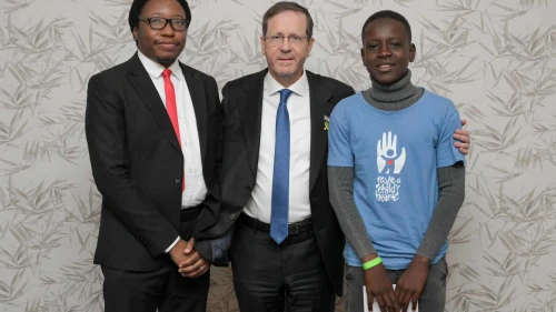 Dr. Kalembe Lwara, Israeli President Isaac Herzog, and a past patient of Save a Child's Heart, Kachese Syapiila, in Lusaka on November 10, 2025. Photo by Maayan Toaf/GPO.