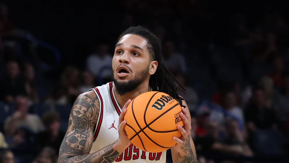 Emanuel Sharp of the Houston Cougars looks to shoot the ball against the Texas A&M Aggies during the first half in the second round of the 2026 NCAA Men's Basketball Tournament at Paycom Center on March 21, 2026 in Oklahoma City, Oklahoma. Photo by Stacy Revere/Getty Images.