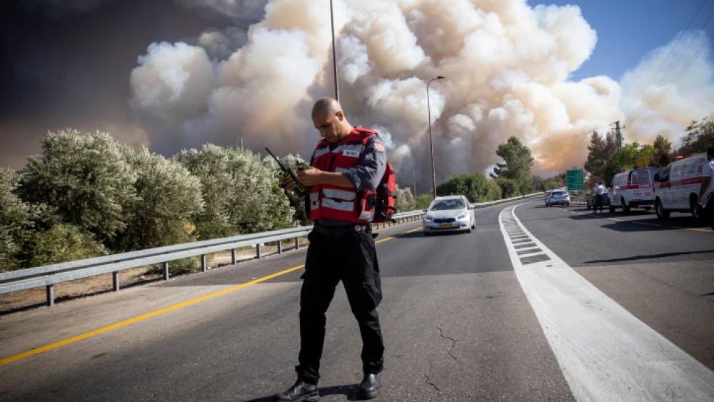 Israeli firefighters combat a blaze near Beit Meir, outside of Jerusalem, on Aug. 15, 2021. Photo by Yonatan Sindel/Flash90.