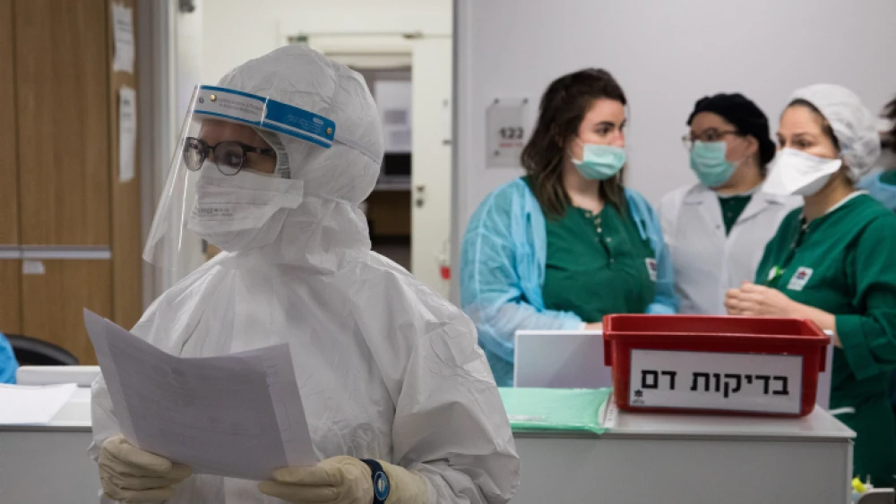 Medical workers at the coronavirus unit in Mayanei Hayeshua Medical Center in Bnei Brak, Israel, prepare a return to other types of procedures as cases of new infection are decreasing, April 27, 2020. Photo by Nati Shohat/Flash90.