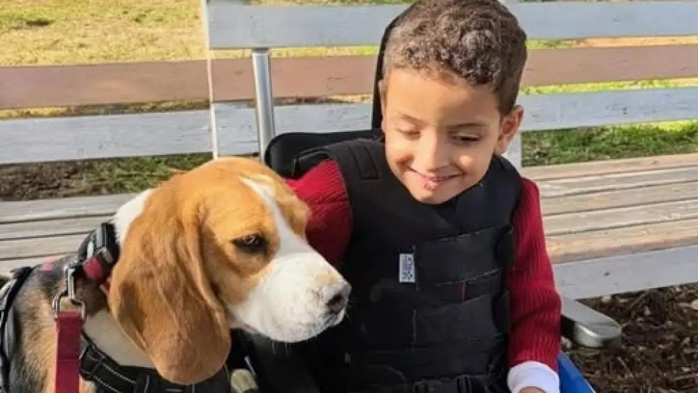 An ADI Negev patient with a canine companion