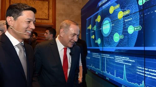 Israeli Prime Minister Benjamin Netanyahu (center) with Chinese Internet entrepreneur Robin Li in Beijing on March 21, 2017. During his trip to China, Netanyahu met with the heads of nearly a dozen of that country’s largest corporations about investment in Israel. Photo by Haim Zach/GPO.