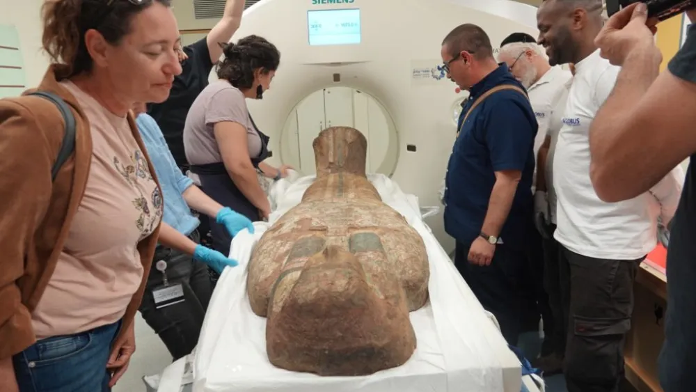 Staff from the Israel Museum and Shaare Zedek Medical Center run a CT scan on a 2,000-year-old Egyptian coffin lid, May 19, 2023. Credit: Shaare Zedek Medical Center.