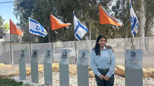 War Room commander Capt. Gaya Shimsilshvili at the IDF Home Front Command’s Urim base, standing by the remembrance corner for soldiers killed on Oct. 7, 2023. Photo by Amelie Botbol.
