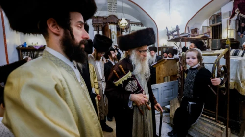 Ultra-Orthodox Jewish men carry Torah scrolls as they dance during Simchat Torah celebrations in Jerusalem's Meah Shearim neighborhood, Oct. 17, 2022. Photo by Olivier Fitoussi/Flash90.