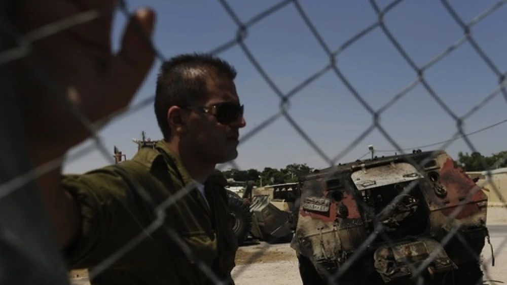 Click photo to download. Caption: The wreckage of an Egyptian military vehicle after terrorists burst it through a security fence into Israel from Egypt, at an Israeli military base along the border with Egypt, southern Israel, Monday, Aug. 6, 2012. Masked gunmen killed scores of Egyptian soldiers Sunday, Aug. 5, 2012, at a checkpoint along the border with Gaza and Israel. Credit: Tsafrir Abayov/Flash90.