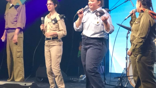 Adi Yehuda (blue uniform, center) and the Special in Uniform band perform their 500th show, at the Zappa Club in Tel Aviv, June 2023. Credit: Judy Lash Balint