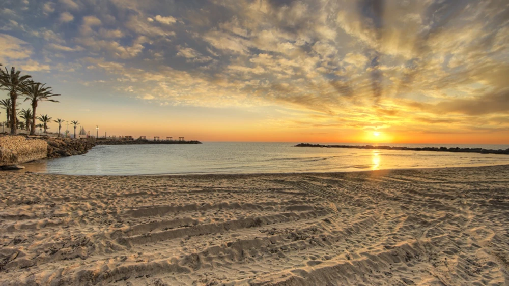 The Nahariya beach at sunrise. Photo by Noam Chen.