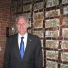 Ambassdor Michael Oren in front of artwork titled "Shalom" at the Banneker Douglass Museum of African American history in Annapolis, Md., with a photo of Maryland Gov. Martin O'Malley in the background. Credit: Paul Foer.