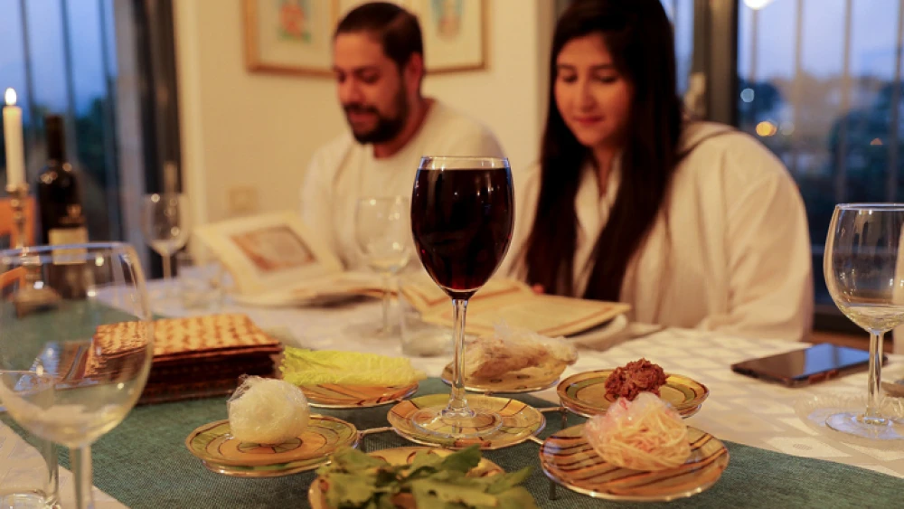 An Israeli family conducts a Passover seder on the first night of the Jewish holiday in Tzur Hadassah, near Jerusalem, on April 8, 2020. Photo by Nati Shohat/Flash90.