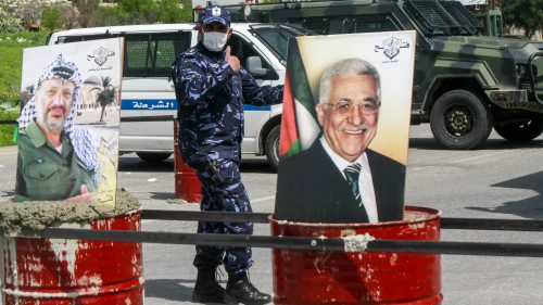 Palestinian security forces on guard as they block the entrance to the city of Shechem to prevent coronavirus (COVID-19) spread, March 23, 2020. Photo by Nasser Ishtayeh/Flash90.