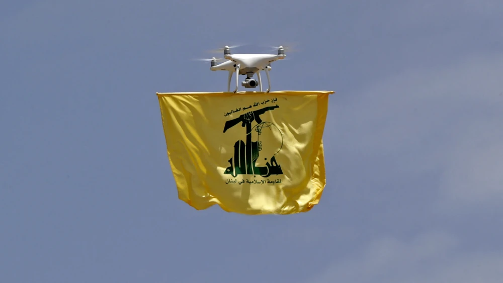 A drone carries a Hezbollah flag above Aaramta in Southern Lebanon on May 21, 2023. Photo by Anwar Amro/AFP via Getty Images.
