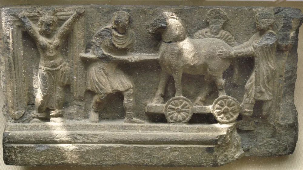 A stone Greco-Buddhist relief depicting the Trojan horse. Credit: Public Domain via Wikimedia Commons.