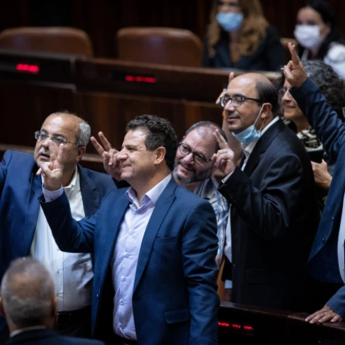 Members of the Arab Joint List take a selfie following a discussion on the "family reunification law", during a plenum session in the assembly hall of the Israeli parliament, in Jerusalem, on July 6, 2021. Photo by Yonatan Sindel/Flash90.