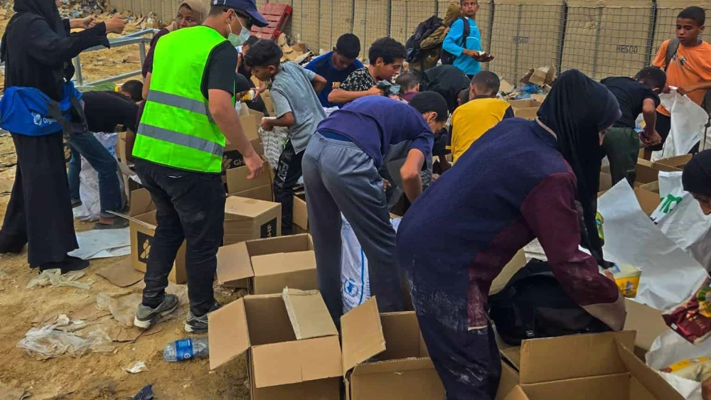 Palestinians receiving aid from the Gaza Humanitarian Foundation in Gaza, June 2025. Credit: GHF.